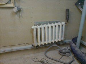 Primer vgradnje grelnega elementa v radiator iz litega železa